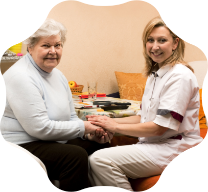 A caregiver holding hands with a resident at Newhaven, Inc.